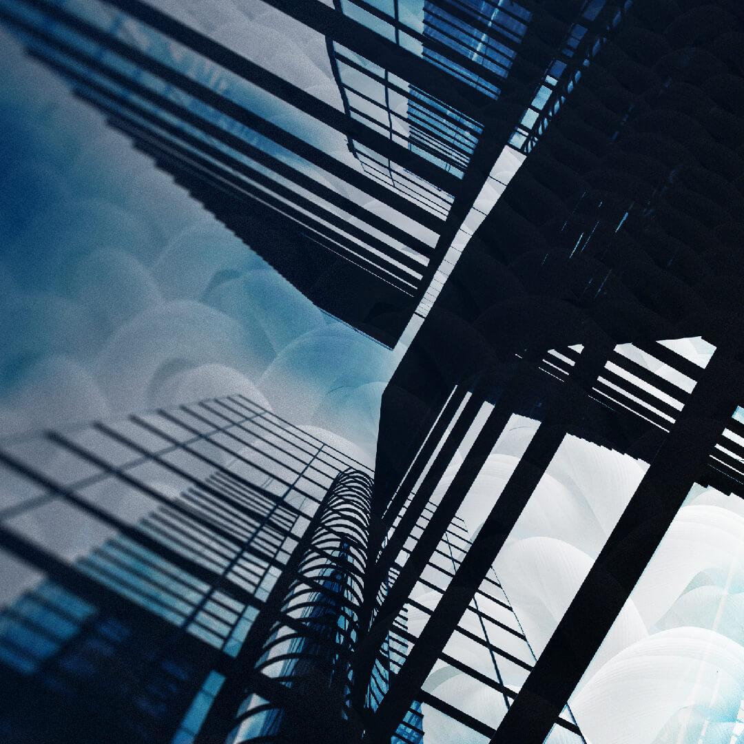 Abstract view of modern glass skyscrapers with reflections, intersecting lines, and a blue sky background.